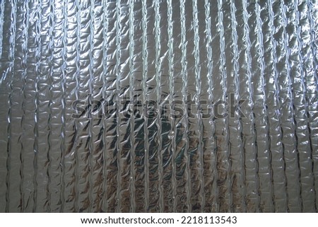 Close up Silver foil insulation texture background. Silver insulation, sound insulation and heat