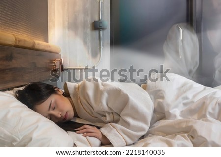 Young asian woman dreaming and soul leaves her body during sleeping at night Beautiful girl get unconscious during sleep She get tired exhausted Death Syndrome or Heart Attrack and Health Care Concept Royalty-Free Stock Photo #2218140035