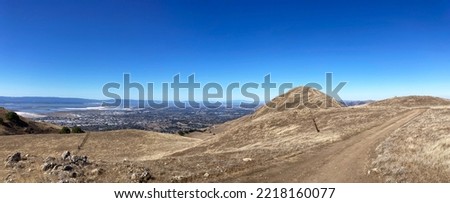 Aerial panoramic view of south San Francisco Bay Area from hiking trail leading to Mission Peak during fall season.