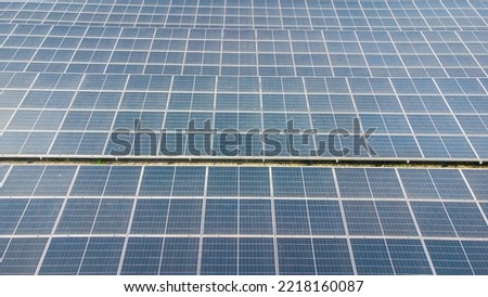 Solar cells on the solar farms of a large industrial factory. Solar farms are generating renewable energy for the industry. The goal is to reduce the cost of electricity.