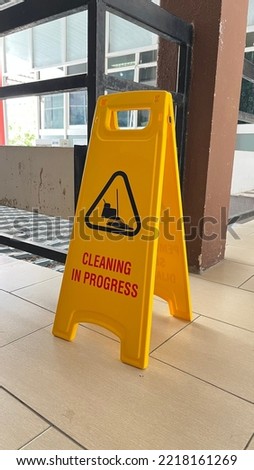 Yellow caution sign for cleaning in progress