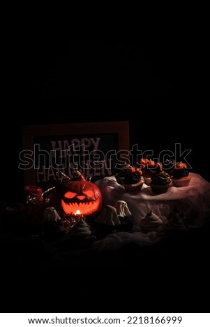 A halloween cupcakes and pumpkin