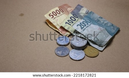 photo of indonesian money with brown background