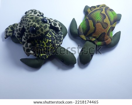 Isolated on white artificial frogs and turtle for toys or decorations or gifts
