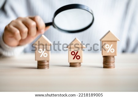 women customer using magnifying glass finding to interest rate home is minimum, affordable alternative price, mortgage home, financial and investment concept.  Royalty-Free Stock Photo #2218189005