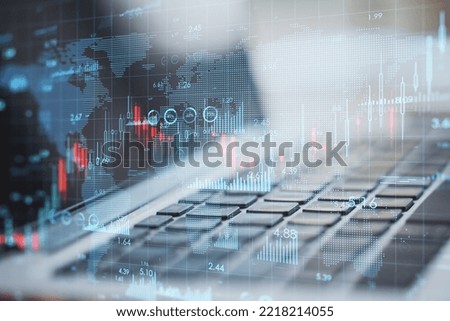 Global business and stock market concept with digital financial chart indicators and world map on modern laptop background, double exposure