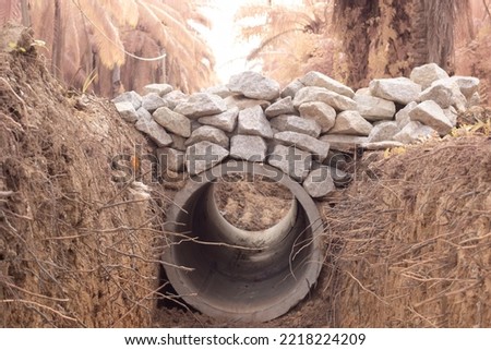 infrared image of the concrete cylindrical drain at the countryside farm