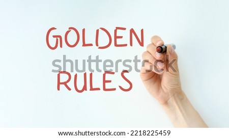 Hand writing inscription Golden Rules with marker, concept