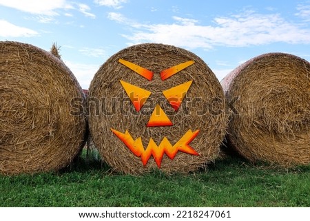 Haystacks decorated for Halloween at farm