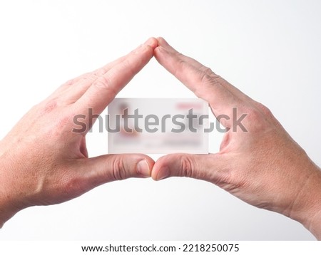 hands holding a blank card