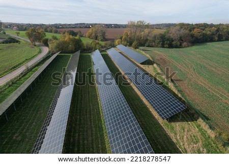 Modern solar power plant, photovoltaic panels green energy electricity production,new power plant,European energy crisis 2022, green deal,Czech republic,European Union,aerial panorama from foggy cloud