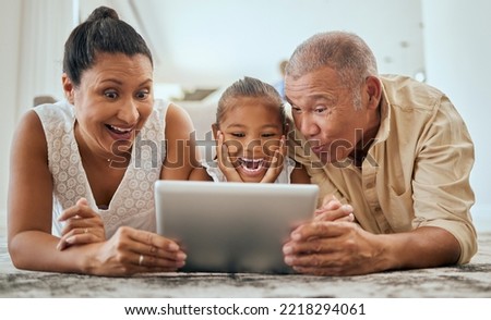 Relax, digital tablet and family on floor in living room, wow and happy with online cartoon or animation in Mexico. Happy family, grandparents and girl bond, watch and enjoy internet fun together