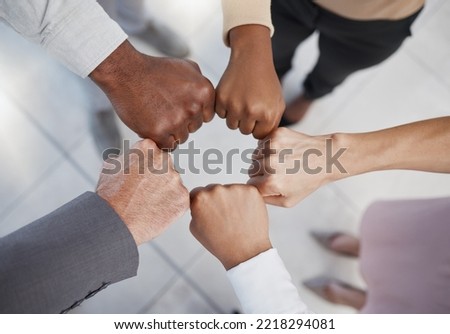 Diversity, hands and team fist above in support, trust and unity for collaboration, agreement or meeting at the office. Group hand of diverse people in teamwork, cooperation and solidarity for fight Royalty-Free Stock Photo #2218294081