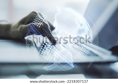 Double exposure of digital America map and hands typing on laptop on background, research and strategy concept Royalty-Free Stock Photo #2218307137