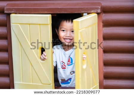 Cute little asian boy  Play happily and happily in the playground on vacation.