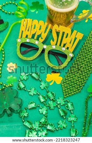 Happy st Patrick's day green decorations,gift with ribbon, green leaves of clover, trefoil,glasses.