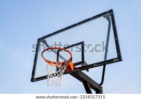 Basketball goalpost in the blue sky Royalty-Free Stock Photo #2218327315