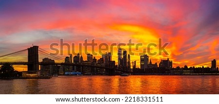 Panorama of  Sunset view of Brooklyn Bridge and panoramic view of downtown Manhattan in New York City, USA