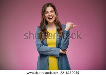 Modern business woman in color suit showing thumb up. Isolated advertising portrait on pink back. Royalty-Free Stock Photo #2218332055