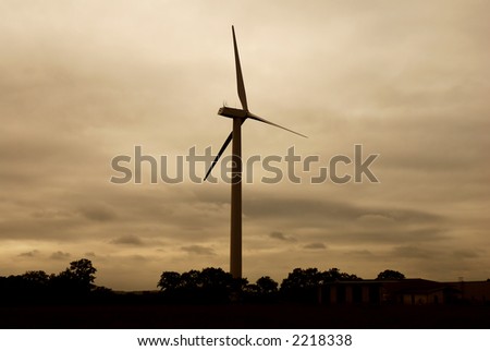 Evening shot of wind turbine. Sepia dominant color.