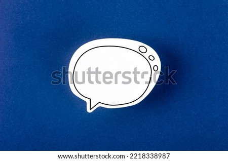 Speech bubble with copy space communication talking speaking concepts on blue background.