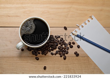 blank notebook coffee cup on wooden background