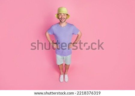 Full size photo high angle view of handsome young man excited traveler enjoy sun wear stylish blue look isolated on pink color background Royalty-Free Stock Photo #2218376319