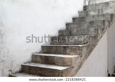 The old concrete stairs on the concrete wall