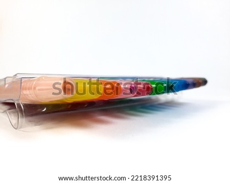 colorful twister crayons on a white background