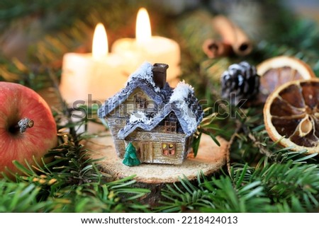 Cute miniature wooden house. Traditional Christmas decoration.