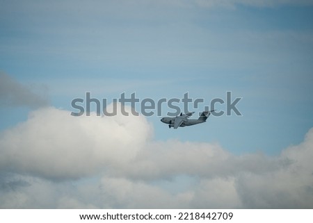 ZM409 RAF Royal Air Force Airbus A400M Atlas military cargo plane on a military exercise, blue cloud sky