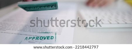 Green approved stamp on document, certificate contract, agreement, lawyer hand Royalty-Free Stock Photo #2218442797