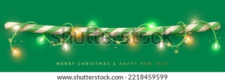 Christmas decoration light garland is wound on line green candy stick. String border holiday decor for web poster banner. Realistic 3d design of bright glowing lights glass lamps. Vector illustration