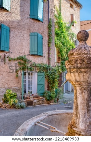 Travel destination, small old village in hear of Provence Cotignac with famous cliffs with cave dwellings and troglodytes houses, Var, Provence Alpes Cote D'Azur, France Royalty-Free Stock Photo #2218489933