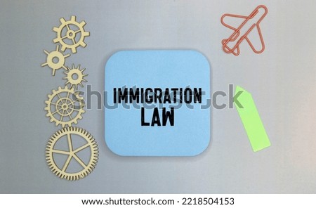 Book with words Immigration Law and glasses