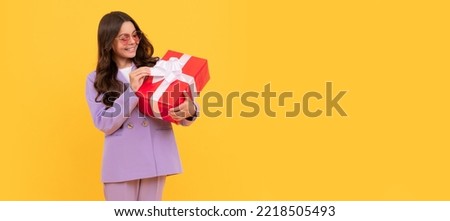 boxing day. happy kid with present box. teen girl giving birthday gift. Kid girl with gift, horizontal poster. Banner header with copy space.
