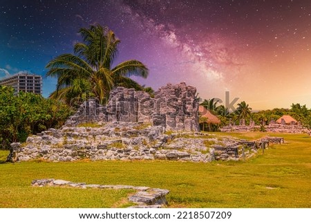 Ancient ruins of Maya in El Rey Archaeological Zone near Cancun, Yukatan, Mexico with Milky Way Galaxy stars night sky.