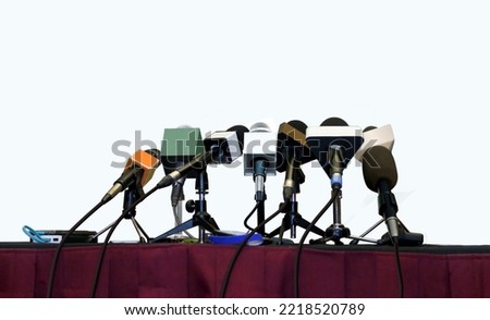 press conference microphones over white background Royalty-Free Stock Photo #2218520789