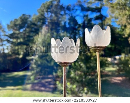 White glass tulips on brass stands