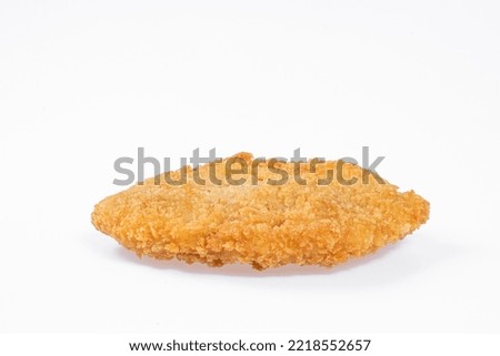 breaded chicken patty round  in high res.image and isolated in white Royalty-Free Stock Photo #2218552657