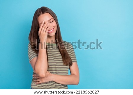 Portrait photo of young adorable gorgeous girlish lady touch head hand laughter comic joke relax empty space information isolated on blue color background