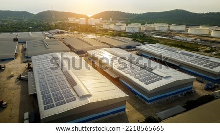 Top view Solar Cell on Warehouse Factory. Solor photo voltaic panels system power or Solar Cell on industrial building roof for producing green ecological electricity. Production of renewable energy. 