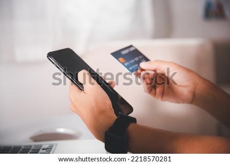 Woman hands holding credit card and smartphone with product purchase at home, Female register via credit cards on mobile phone to make digital payment security online, Internet online shopping concept Royalty-Free Stock Photo #2218570281