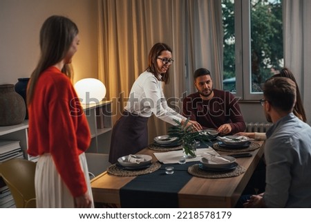 female friends hosting a party at home