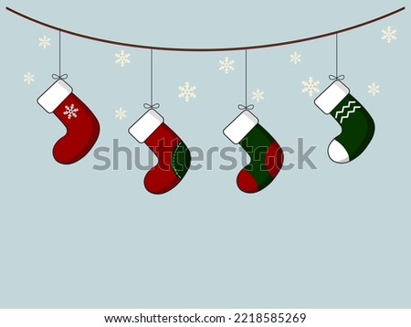 Vector illustration of hanging christmas socks. Blue background layout design with snowflakes