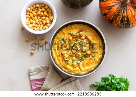 Pumpkin hummus with seeds and greens. Healthy eating. Vegetarian food. Diet. Royalty-Free Stock Photo #2218586283