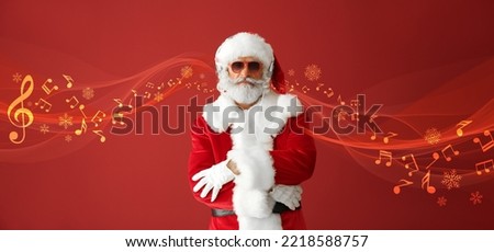 Banner with cool Santa Claus listening to music on red background