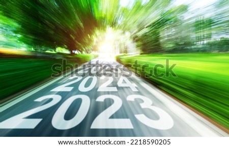 New year 2023 to 2026 written on highway with blurred motion Royalty-Free Stock Photo #2218590205