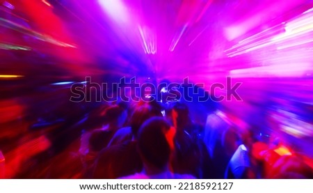 Blurred dancing people in a disco, cheery party Royalty-Free Stock Photo #2218592127