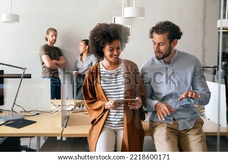 Team of young creative marketing experts brainstorming during work Royalty-Free Stock Photo #2218600171